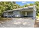 Side view of a single story home with a carport, showing the entrance and well-maintained exterior at 7595 Clayton Blvd # B, Clayton, NC 27520