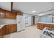 Well-lit kitchen featuring vintage wood cabinets, ample counter space and appliances at 7595 Clayton Blvd # B, Clayton, NC 27520