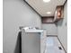 Functional laundry room with washer, dryer, and ample storage space at 7595 Clayton Blvd # B, Clayton, NC 27520