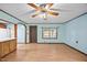 Bright living room with ceiling fan, wood-look flooring, and an open layout at 7595 Clayton Blvd # B, Clayton, NC 27520