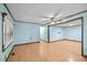 Spacious living room featuring wood-look flooring and a ceiling fan at 7595 Clayton Blvd # B, Clayton, NC 27520