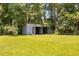 Exterior view of a large storage shed in the backyard of the property, providing extra storage space at 7595 Clayton Blvd # B, Clayton, NC 27520