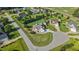 Aerial view showcasing well-maintained property, manicured lawn, and surrounding neighborhood at 8101 Claybrooke Ct, Willow Springs, NC 27592