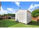 Backyard shed next to the above ground pool and the house with well-maintained green grass at 8101 Claybrooke Ct, Willow Springs, NC 27592