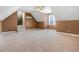 Large bonus room featuring carpeting, slanted ceilings, a window, and two-tone paint at 8101 Claybrooke Ct, Willow Springs, NC 27592
