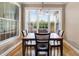 Charming dining area featuring hardwood floors, abundant natural light, and a stylish chandelier at 8101 Claybrooke Ct, Willow Springs, NC 27592