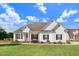 Charming one-story home featuring white siding, a manicured lawn, and a classic architectural design at 8101 Claybrooke Ct, Willow Springs, NC 27592