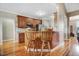 Cozy kitchen offering hardwood floors, ample cabinet space, and a convenient breakfast bar at 8101 Claybrooke Ct, Willow Springs, NC 27592