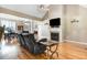 Comfortable living space boasting a fireplace, hardwood floors, and a view to other rooms at 8101 Claybrooke Ct, Willow Springs, NC 27592