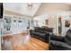 Inviting living room featuring hardwood floors, vaulted ceilings, and a decorative fireplace at 8101 Claybrooke Ct, Willow Springs, NC 27592