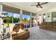 Sun room featuring comfortable furniture, plenty of natural light, and a view of the pool at 8101 Claybrooke Ct, Willow Springs, NC 27592