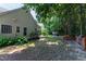 Lush backyard featuring a fire pit, patio, and a grill, creating an ideal space for outdoor gatherings at 8205 Rolling Glenn Dr, Raleigh, NC 27616