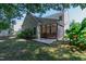 A backyard featuring a cozy screened-in porch and a concrete patio, perfect for outdoor enjoyment at 8205 Rolling Glenn Dr, Raleigh, NC 27616