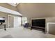 Bonus room area with vaulted ceiling, a large screen TV, and a comfortable armchair at 8205 Rolling Glenn Dr, Raleigh, NC 27616