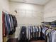 Walk-in closet with custom shelving and ample storage space for clothing and accessories at 8205 Rolling Glenn Dr, Raleigh, NC 27616