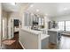A bright kitchen showcases gray cabinets, stainless steel appliances, and an island with a white countertop at 8205 Rolling Glenn Dr, Raleigh, NC 27616