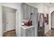 Efficient kitchen with grey cabinetry, stainless steel refrigerator, and modern appliances at 8205 Rolling Glenn Dr, Raleigh, NC 27616