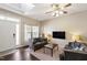 Inviting living room featuring hardwood floors, neutral decor, and abundant natural light at 8205 Rolling Glenn Dr, Raleigh, NC 27616