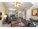 Bright living room featuring hardwood floors, neutral decor, and open floor plan at 8205 Rolling Glenn Dr, Raleigh, NC 27616