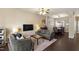 Bright living room featuring hardwood floors, neutral decor, and open floor plan at 8205 Rolling Glenn Dr, Raleigh, NC 27616