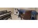 Office space featuring a blue desk, a brown chair, a keyboard, and white shelves at 8205 Rolling Glenn Dr, Raleigh, NC 27616