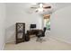 Office space with a desk, chair, and wooden shelves next to a bright window at 8205 Rolling Glenn Dr, Raleigh, NC 27616