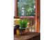 Close up of the decorations on the table of the screened porch with an outdoor view at 8205 Rolling Glenn Dr, Raleigh, NC 27616