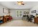 Room with natural light featuring a piano and computer desk at 860 Cokesbury Rd, Fuquay Varina, NC 27526
