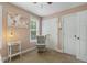 Neutral Bedroom with a glider chair, window views, and ample closet space at 860 Cokesbury Rd, Fuquay Varina, NC 27526