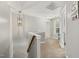Upstairs hallway featuring carpet, a modern chandelier, and neutral paint at 860 Cokesbury Rd, Fuquay Varina, NC 27526