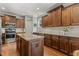 Kitchen with center island, stainless steel appliances, and custom cabinets at 860 Cokesbury Rd, Fuquay Varina, NC 27526