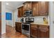Kitchen showing stainless steel oven and microwave and granite counters at 860 Cokesbury Rd, Fuquay Varina, NC 27526