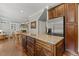 Kitchen island with granite countertops and open-concept living space at 860 Cokesbury Rd, Fuquay Varina, NC 27526