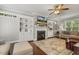 Cozy living room with a fireplace, built-in shelving, and natural light at 860 Cokesbury Rd, Fuquay Varina, NC 27526