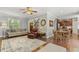 Open-concept living room and kitchen area with hardwood floors at 860 Cokesbury Rd, Fuquay Varina, NC 27526