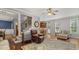 Spacious living room featuring stairs, hardwood floors and ample seating at 860 Cokesbury Rd, Fuquay Varina, NC 27526
