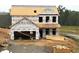 Exterior view of a home in the initial construction phase, with visible lumber at 10 Malbec Way, Youngsville, NC 27596
