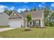 Charming single-Gathering home with a well-manicured lawn and attached two-car garage at 1012 Rhino Bnd, Oxford, NC 27565