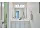 A bathroom with double vanity, granite countertop, and modern fixtures at 102 Duxbury Dr, Cary, NC 27513