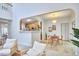 Open-concept living area with dining nook with modern table and seating at 102 Duxbury Dr, Cary, NC 27513