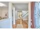 Bright foyer with hardwood floors leading to a dining area and staircase at 102 Duxbury Dr, Cary, NC 27513