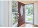 Inviting foyer with an open front door, hardwood floors, and a view of the staircase at 102 Duxbury Dr, Cary, NC 27513