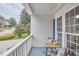 Inviting front porch with cozy seating area and view of the neighborhood at 102 Duxbury Dr, Cary, NC 27513