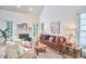 Inviting living room with a fireplace, large windows, and comfortable seating at 102 Duxbury Dr, Cary, NC 27513