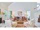 Spacious living room with vaulted ceiling, comfortable seating, and abundant natural light at 102 Duxbury Dr, Cary, NC 27513