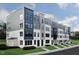 Modern townhome featuring a sleek design, multiple levels, and outdoor balconies in a residential community at 10537 Pleasant Branch Dr # 201, Raleigh, NC 27614