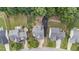 An overhead view of the houses on a tree lined street with spacious green lawns at 1144 Dexter Ridge Dr, Holly Springs, NC 27540