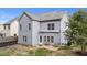 The house has a cozy backyard with a patio and chairs, perfect for relaxing or entertaining at 1144 Dexter Ridge Dr, Holly Springs, NC 27540