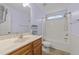 Cozy bathroom features a single sink with wood cabinets and a shower-tub combination at 1144 Dexter Ridge Dr, Holly Springs, NC 27540