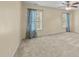 Comfortable bedroom with two windows allowing for natural light and a ceiling fan at 1144 Dexter Ridge Dr, Holly Springs, NC 27540